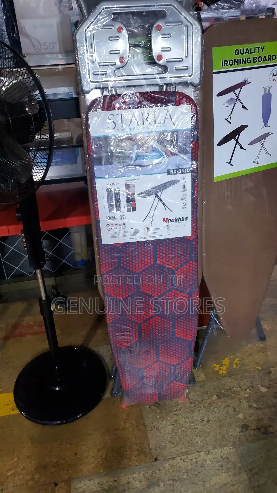 Medium Size Ironing Board With a Flat Iron Stand.