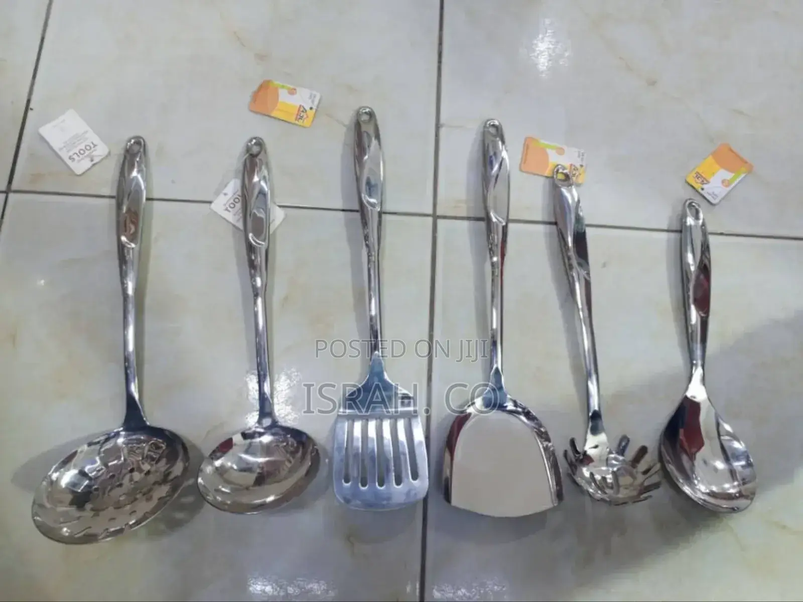 A Set of Six Stainless Steel Kitchen Serving Tools