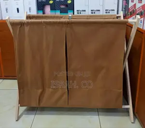 Double Laundry Hamper With a Light-Colored Wooden Frame