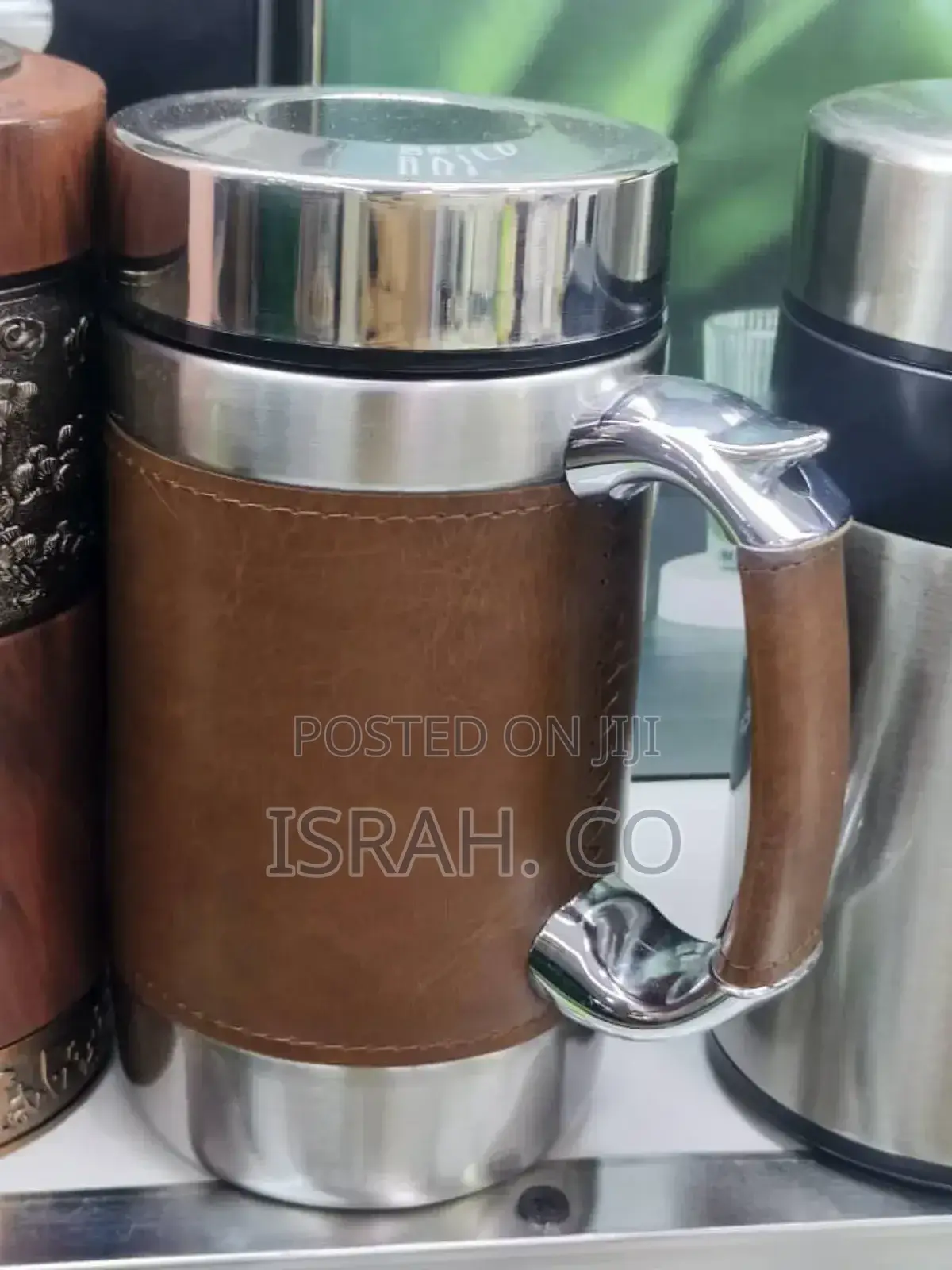Stainless Steel Coffee Mug With a Leather Sleeve and Handle