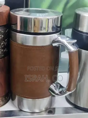 Stainless Steel Coffee Mug With a Leather Sleeve and Handle