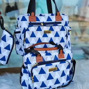 A Set of Baby Diaper Bags With a Blue, White, and Gray