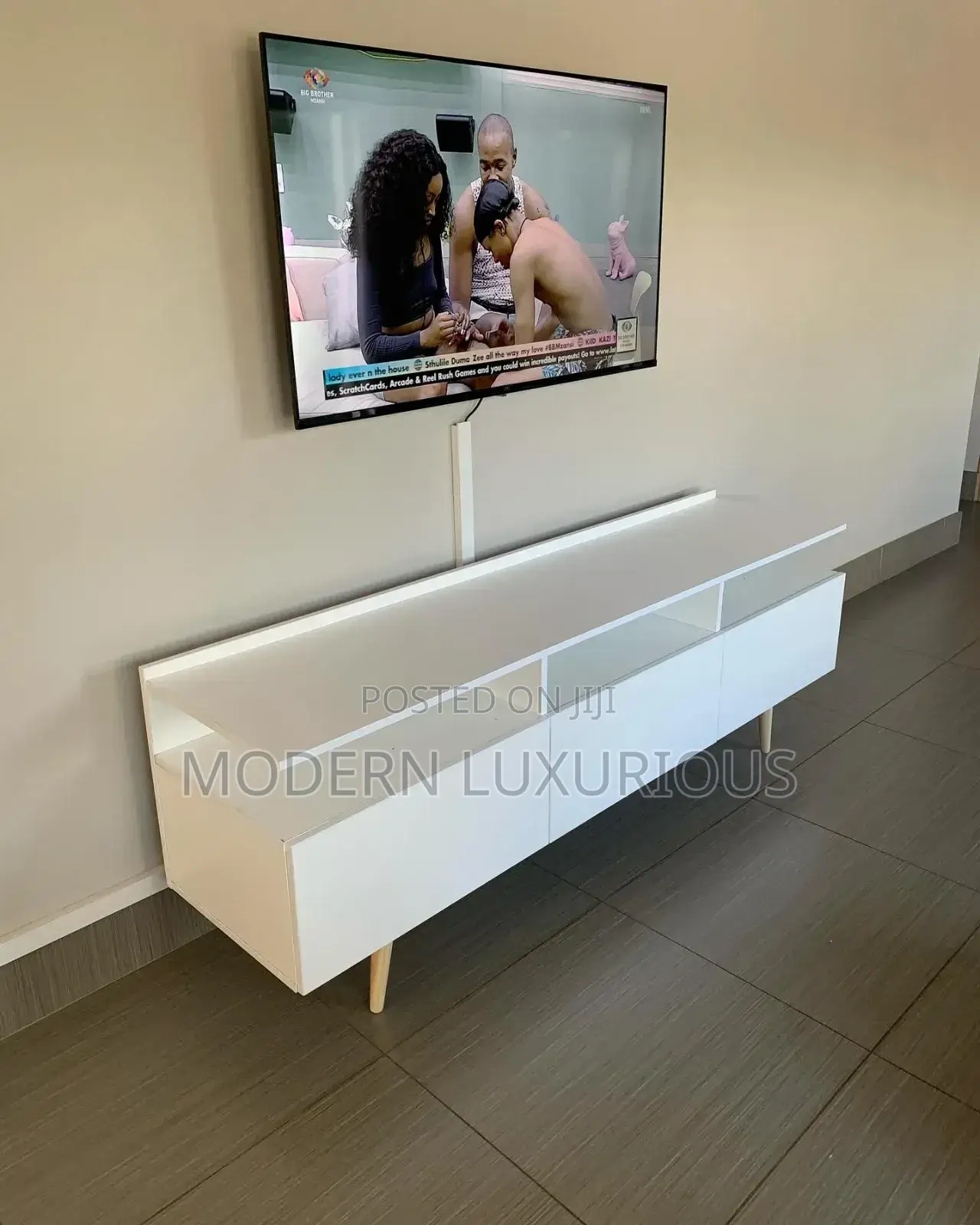 /Experience the/ Difference With Our Premium Black Tv Stand