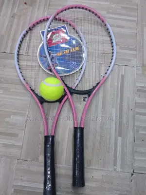 A Set of Tennis Racket With a Tennis Ball