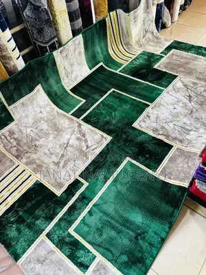 Large Sized Green and Cream Designed Carpet