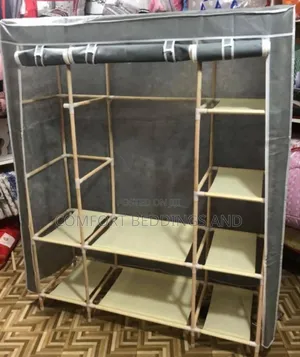 Three Column Wooden Closet With a Cloth