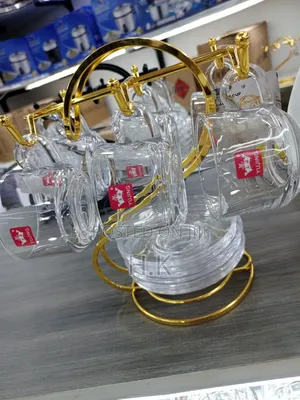 Glass Teacups and Saucers + Gold-Colored Metal Stand.