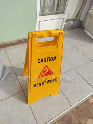 Men At Work Sign Post