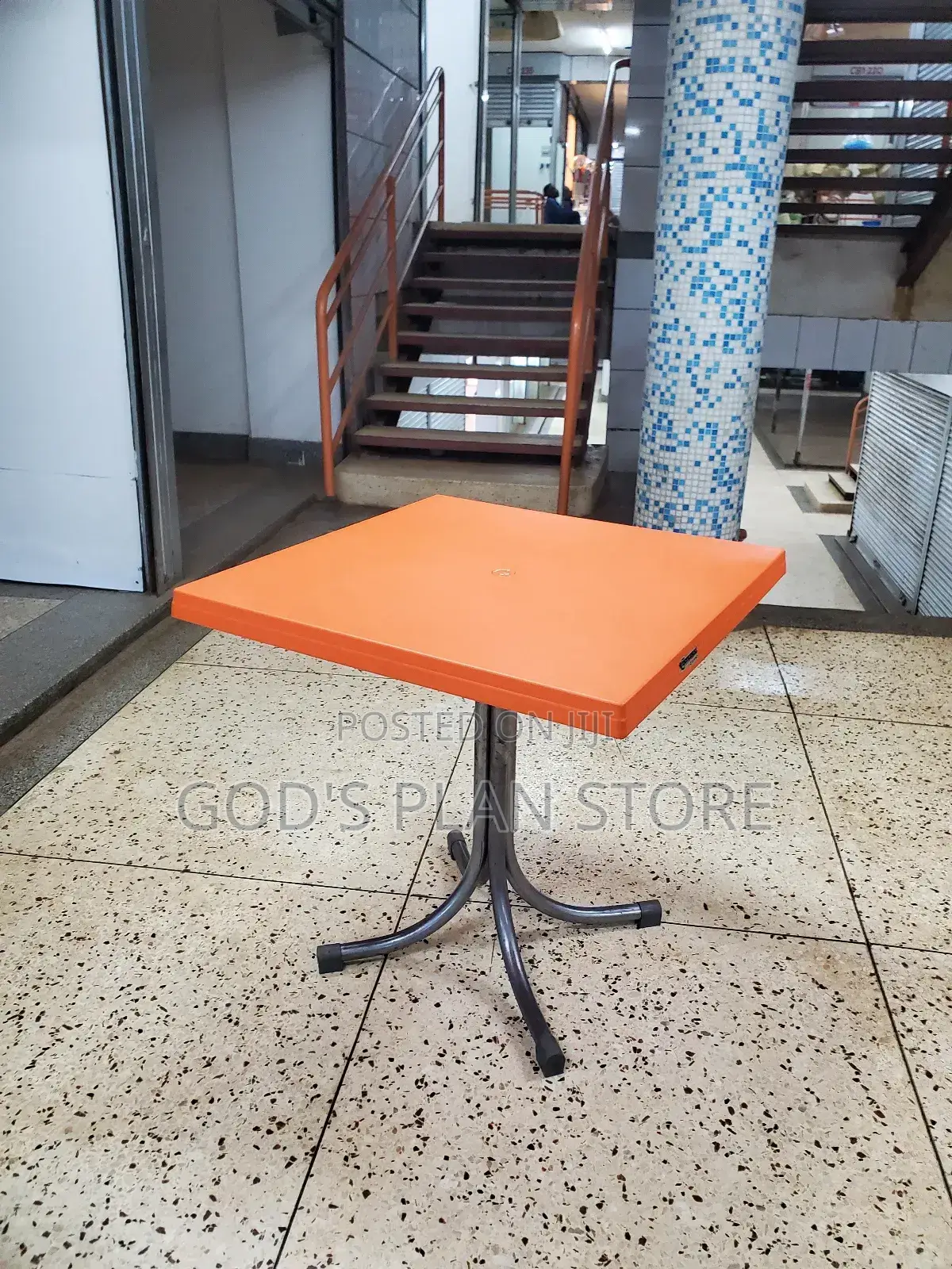 Orange Plastic Table With Metallic Legs