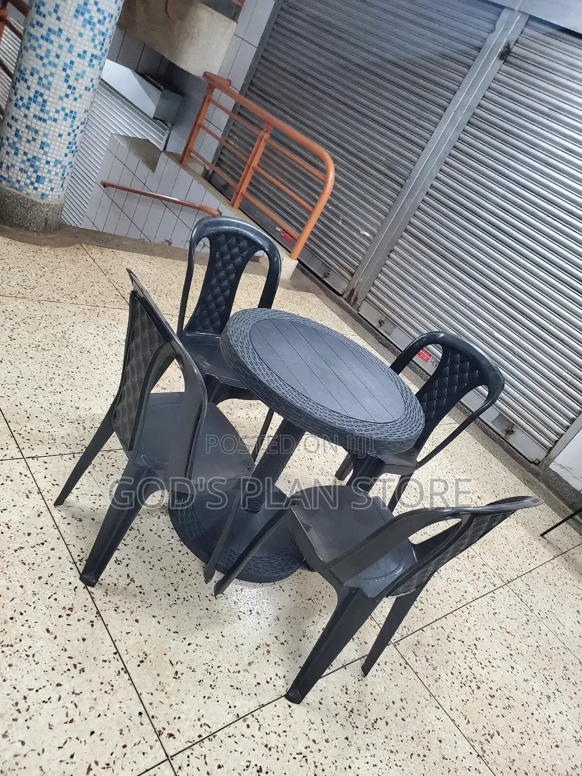 A Set of Round Table and Chairs