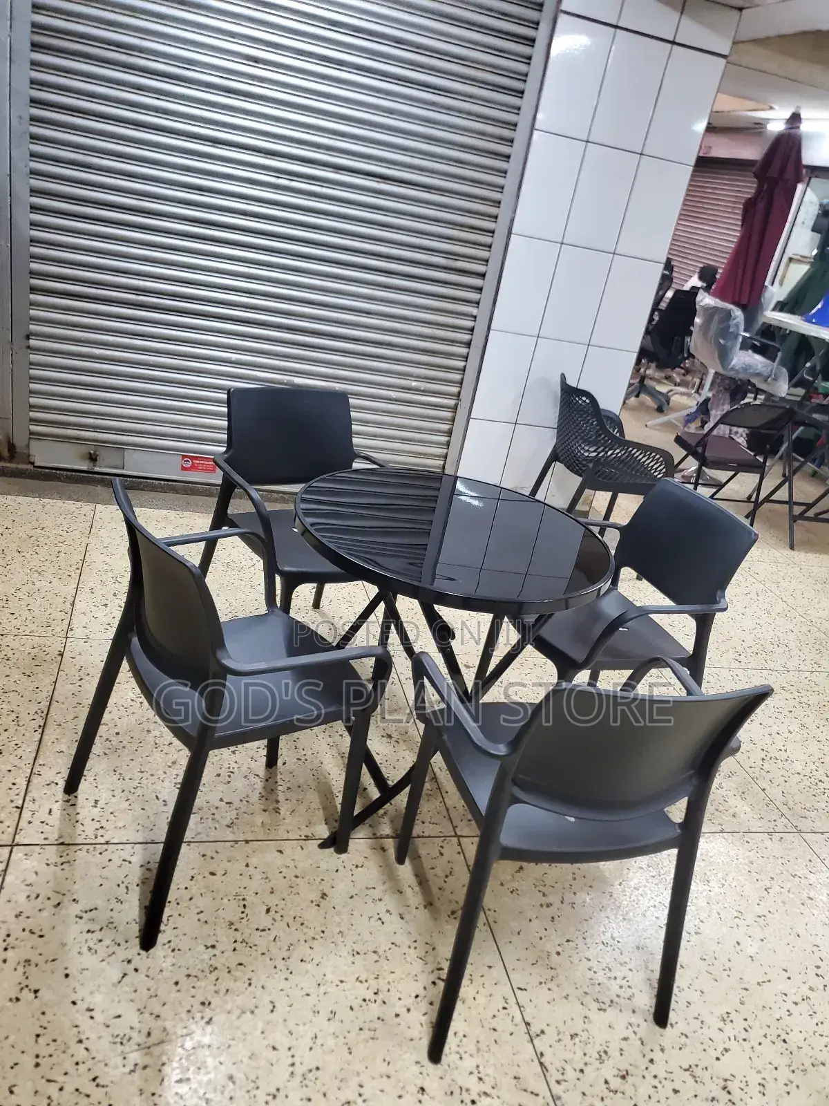 Plastic Chairs and Glass Table Set