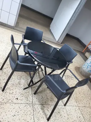 Plastic Chairs and Glass Table Set