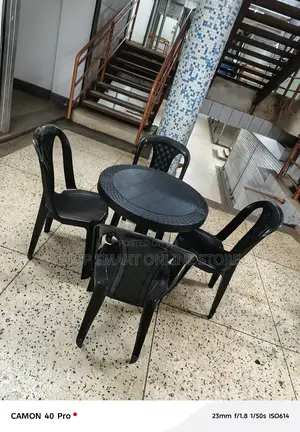 A Set of Plastic Tabe and Chairs