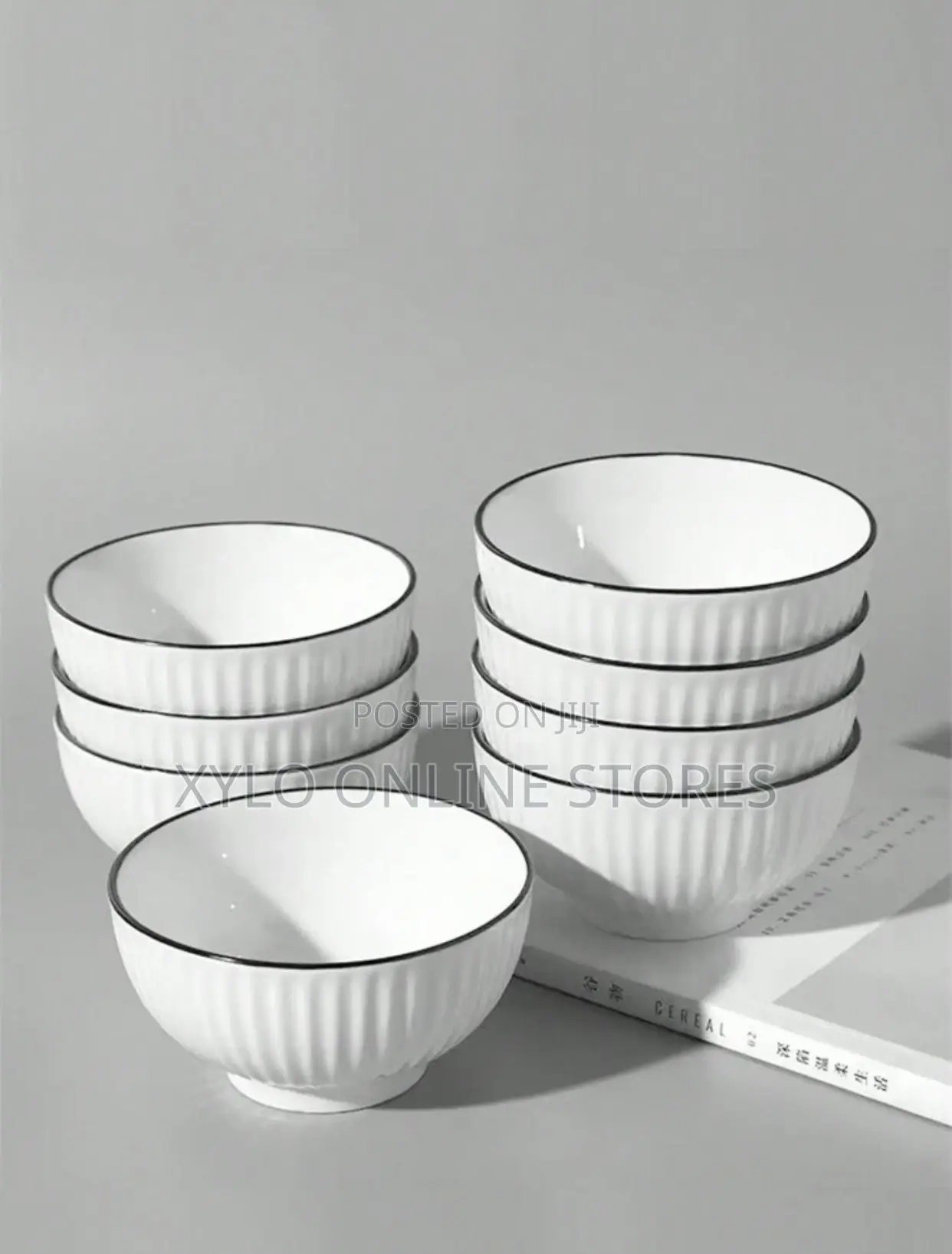 A Set of 6 White Ceramic Soup Bowls With a Black Ring