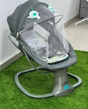 Electric Baby Swing With a Mosquito Net