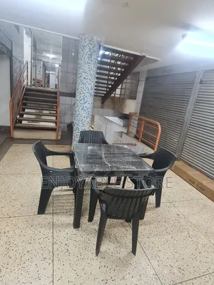 A Set of Plastic Chairs Dining and Table 4 Seaters