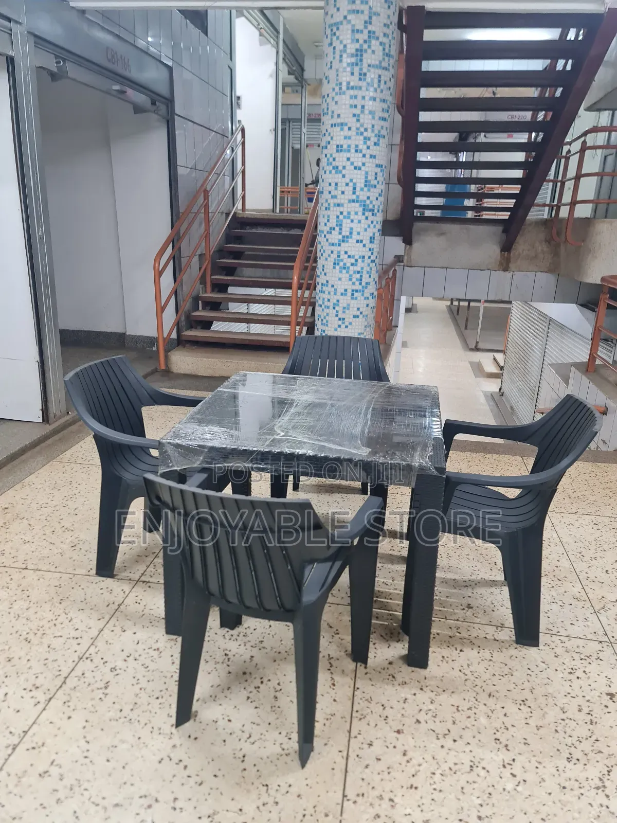 A Set of Plastic Chairs Dining and Table 4 Seaters