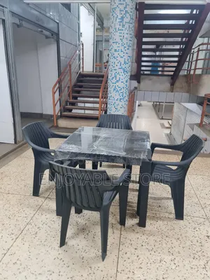A Set of Plastic Chairs Dining and Table 4 Seaters