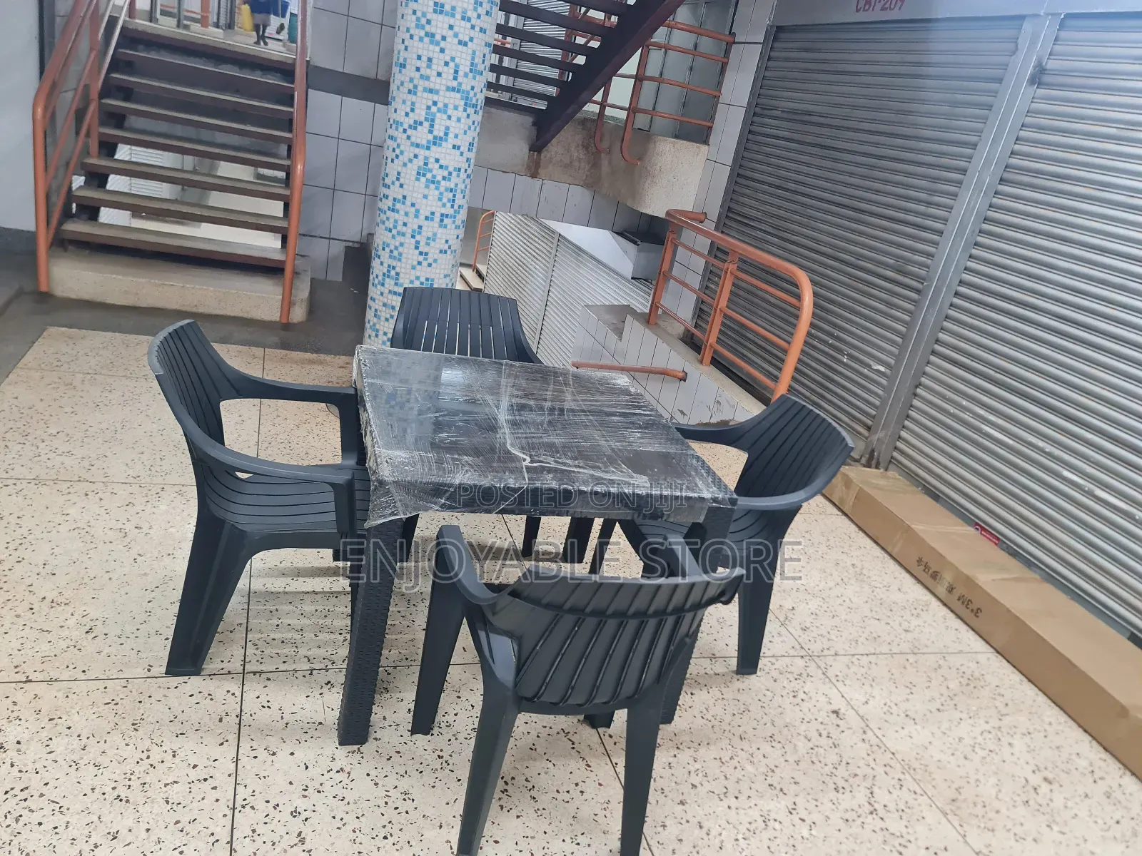 A Set of Plastic Chairs Dining and Table 4 Seaters
