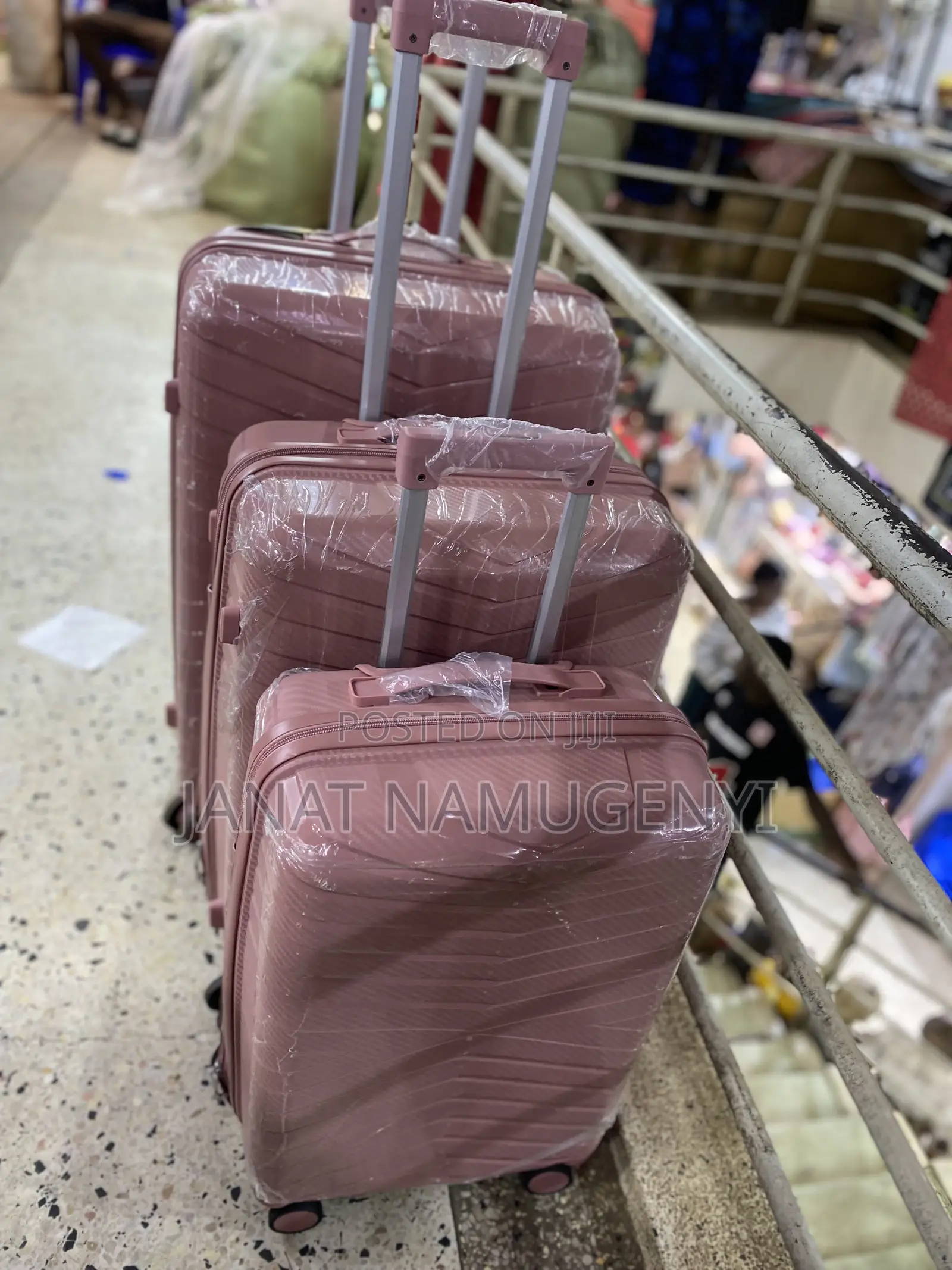 A Set of 3 Rubber Pink Suitcases