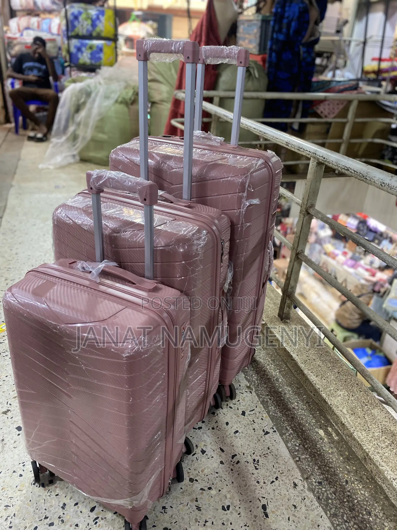 A Set of 3 Rubber Pink Suitcases