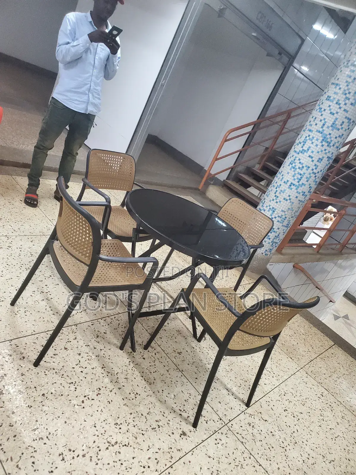 Round Glass Table and Plastic Chairs