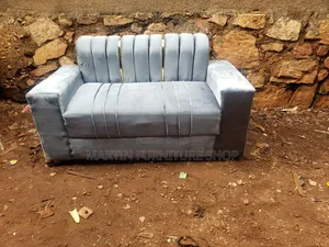 Brand New 2 Seater Sofa Set With Golden Stickers in Its Back