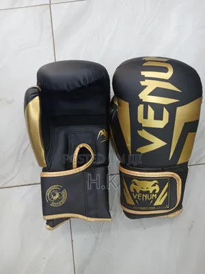 Venum Elite Boxing Glove in Black and Gold.