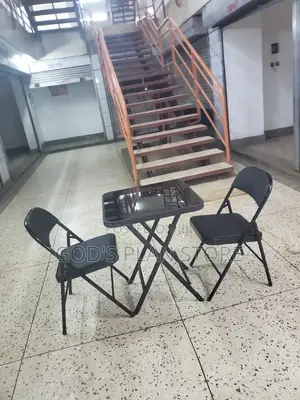 2 Leather Foldable Chairs and Foldable Glass Table