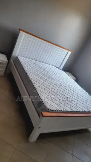 5by 6 White and Brown Bed With Bedside Drawers