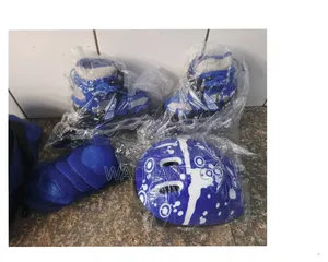 A Pair of Roller Skate Shoes With Helmet and Protective Gear