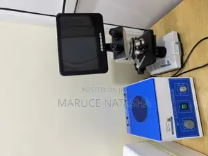 A Set of a Trinocular Microscope With a 6 Buckets Electric Centrifuge