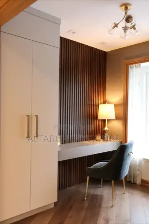 Classic White Master Wardrobe With a Reading Table and a Chair