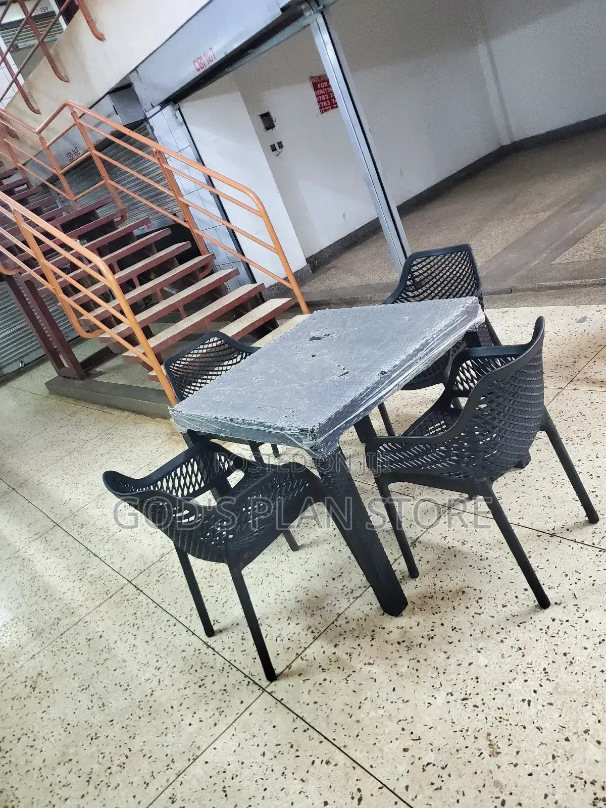 4 Seater Plastic Table and Egypt Armed Chairs Plastic