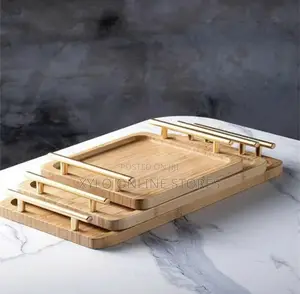 A Set of 3 Bamboo Trays With a Gold Handle