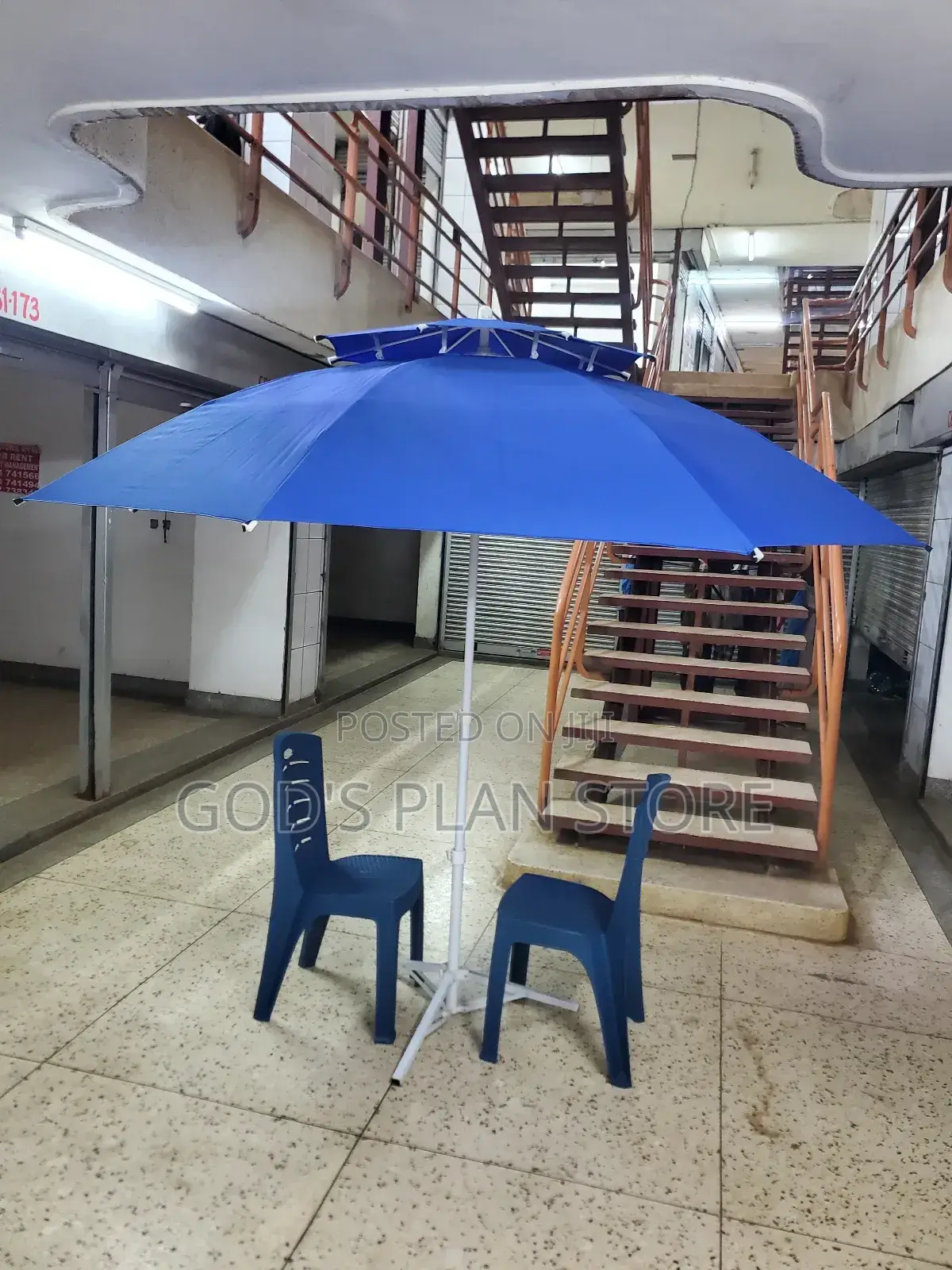 Outdoor Restaurant and Bar Umbrellas With Two Chairs