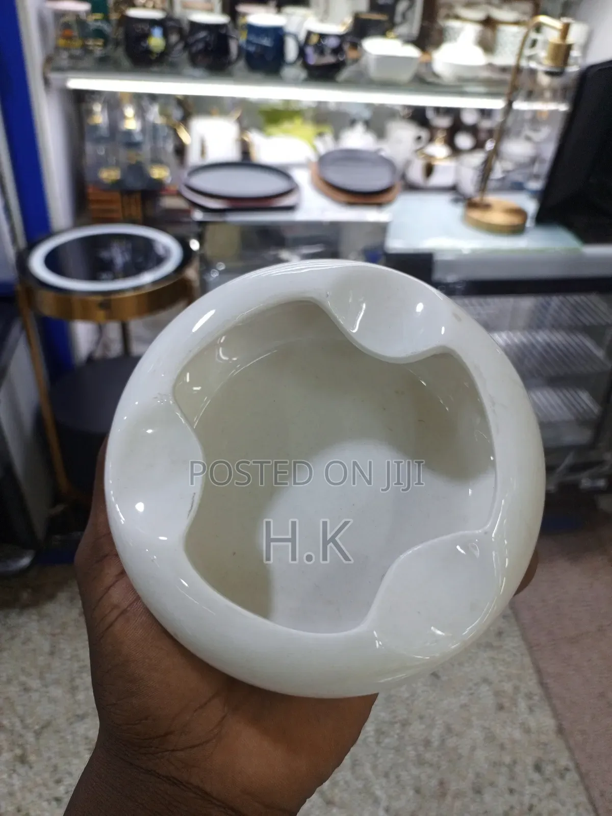 Ceramic Ashtray With a Wooden Base.