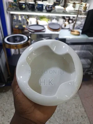 Ceramic Ashtray With a Wooden Base.
