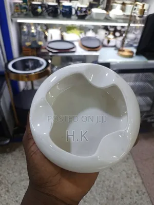 Ceramic Ashtray With a Wooden Base.