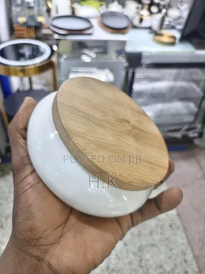 Ceramic Ashtray With a Wooden Base.