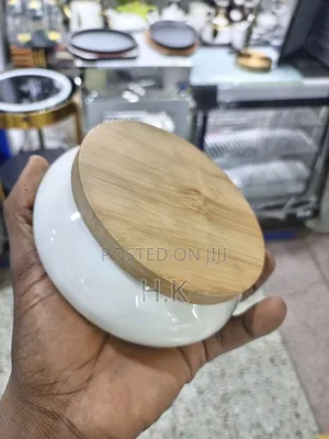 Ceramic Ashtray With a Wooden Base.