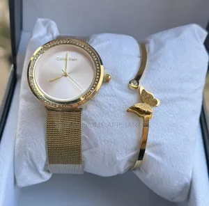 Golden Calvin Klein Wrist Analog Time Piece With a Genuine Bracelet