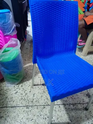 Plastic Chair With Metallic Legs.