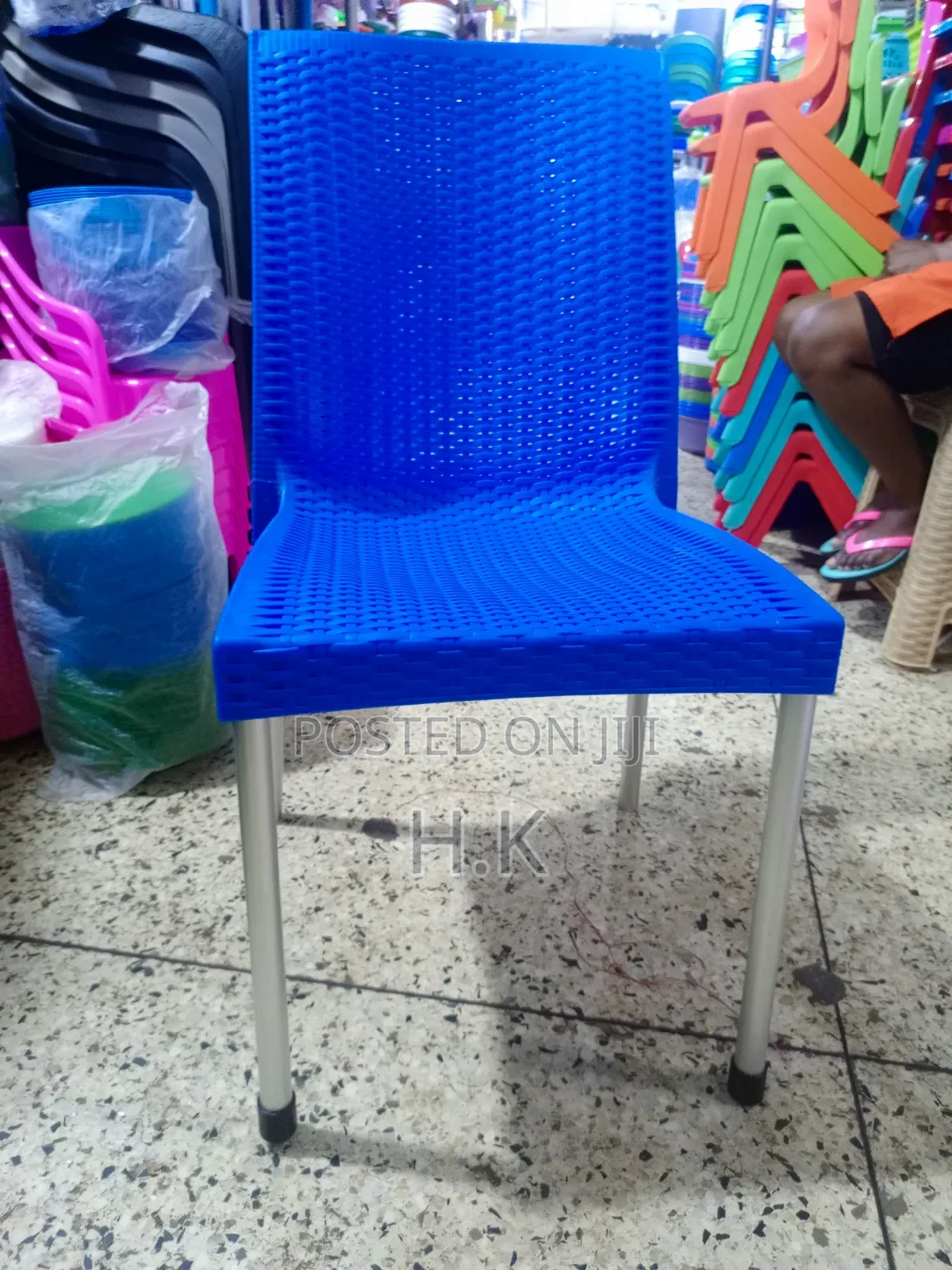 Plastic Chair With Metallic Legs.