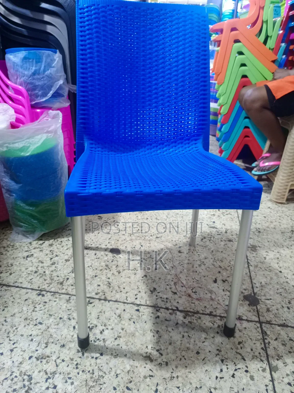 Plastic Chair With Metallic Legs.