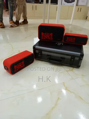 Xdobo 1983 Series Portable Bluetooth Speakers and a Carrying Case.