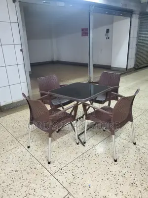Noble Dining Plastic Chairs and Glass Table Set.