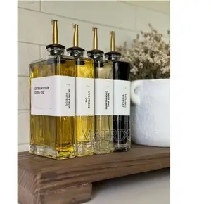 A Set of 4 Borosillicate Glass Oil Dispensers