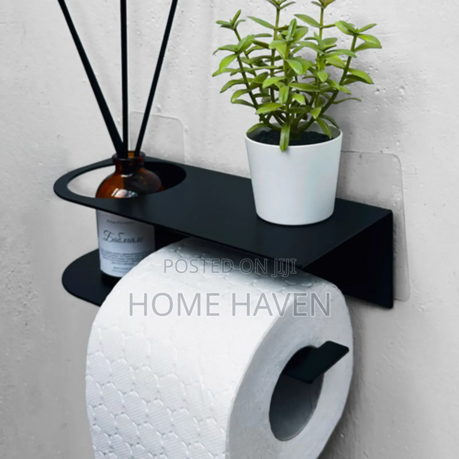 Wall Mounted Toilet Paper Holder With an Integrated Shelf