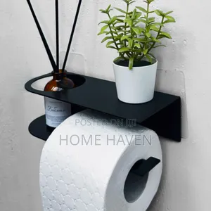 Wall Mounted Toilet Paper Holder With an Integrated Shelf